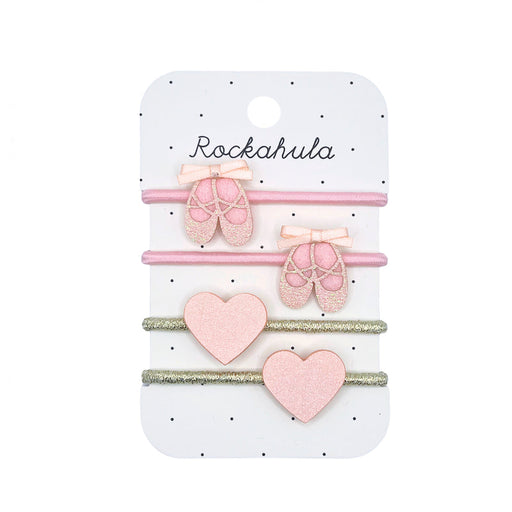 Set of pink hair accessories on a Rockahula branded card