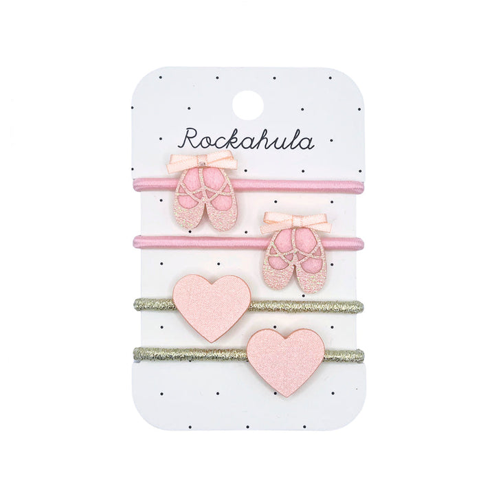 Set of pink hair accessories on a Rockahula branded card