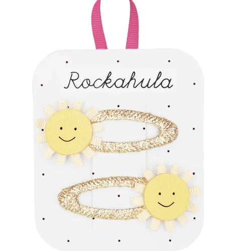 Sun-shaped hair clips on a Rockahula branded card with a pink ribbon.
