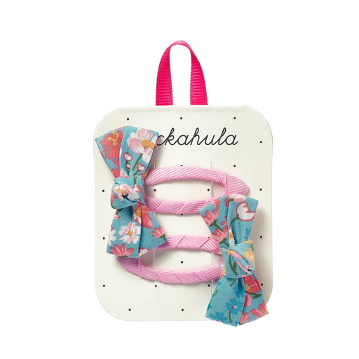 Set of hair accessories including bows and ribbons on a branded card with rockahula branding.