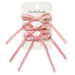 Pink hair bows with ribbons on a Rockahula branded card.