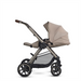 Beige and black stroller on a white background