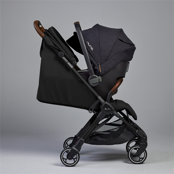 Black stroller with wooden accents on a gray background