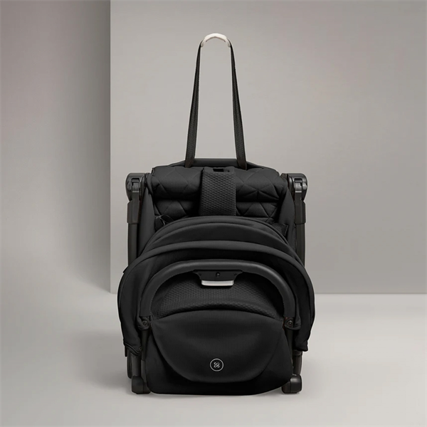 Black backpack with a built-in handle on a gray background