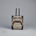 Beige rolling suitcase with backpack attachment on a gray background