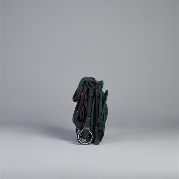 Silvercross stroller folded on a gray background
