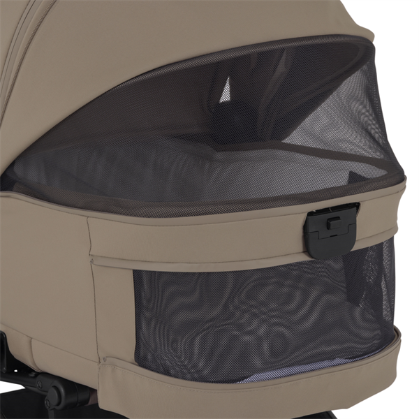 Close-up of a beige stroller with a black mesh cover on a white background
