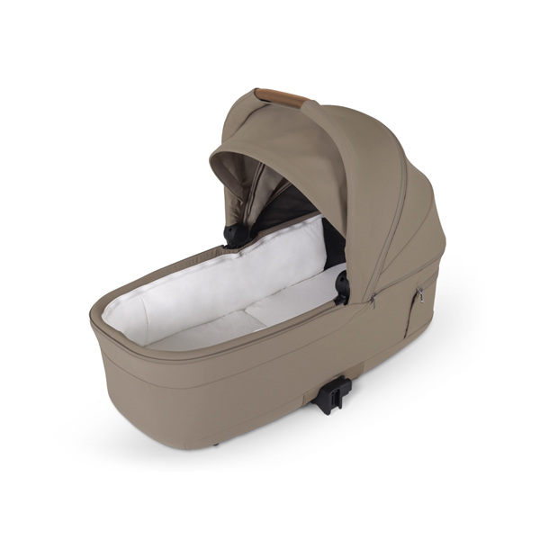 Beige baby bassinet on a white background