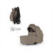 Beige baby stroller with IATA Cabin Compliant label on a white background
