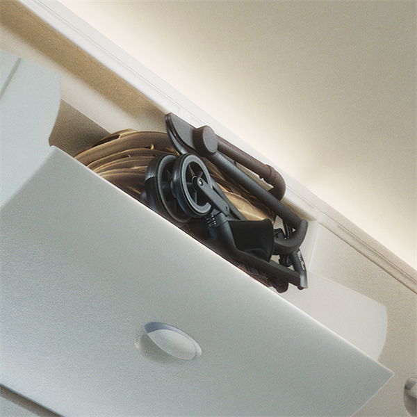 Foldable bicycle stored inside a white cabinet with a neutral background