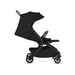 Black stroller with brown accents on a white background