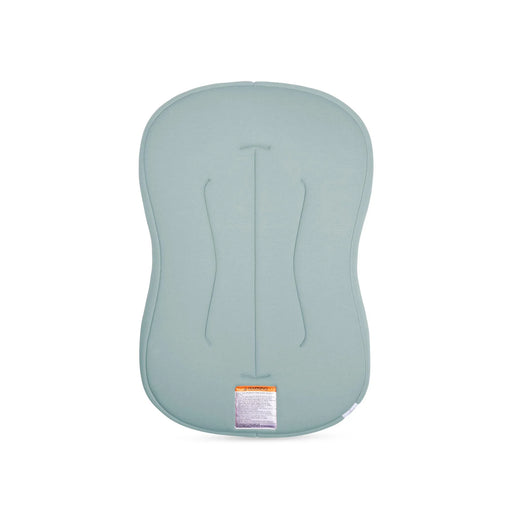 Light blue infant lounger with a warning label on a white background