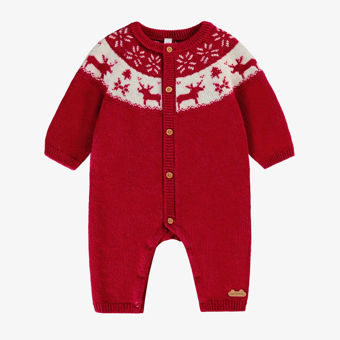 Red knit baby romper with white reindeer pattern on a white background