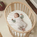 caption-Stokke Mini Protector Sheet with baby