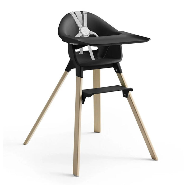 Black high chair with wooden legs on a white background