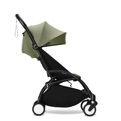 Black and olive green travel stroller on a white background