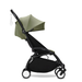 Black and olive green travel stroller on a white background