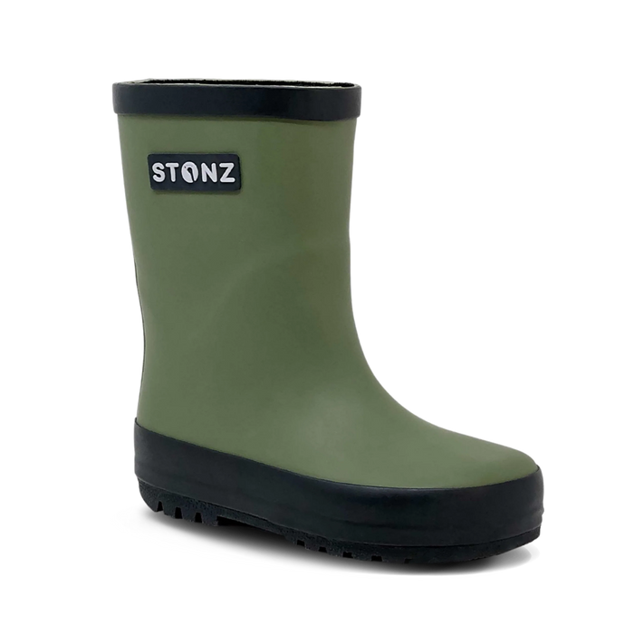 Green rain boot with black sole on a white background