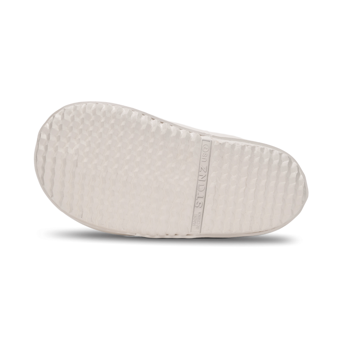 White shoe of rainboot tread on a white background