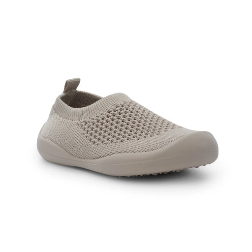 Beige slip-on shoe on a white background