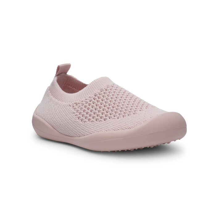 Pink slip-on shoe on a white background