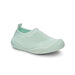 Mint green slip-on shoe on a white background