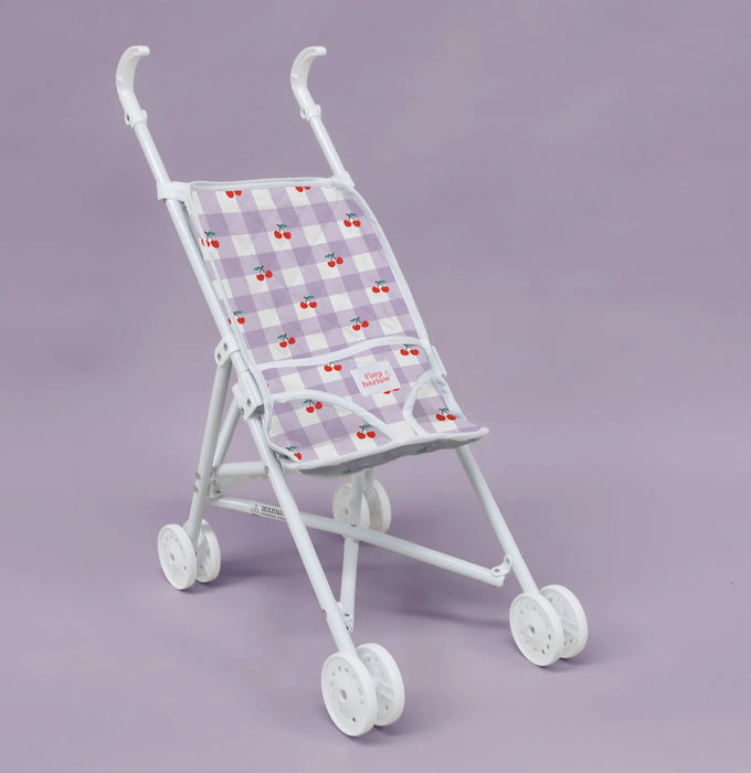 White baby stroller with a patterned canopy on a purple background