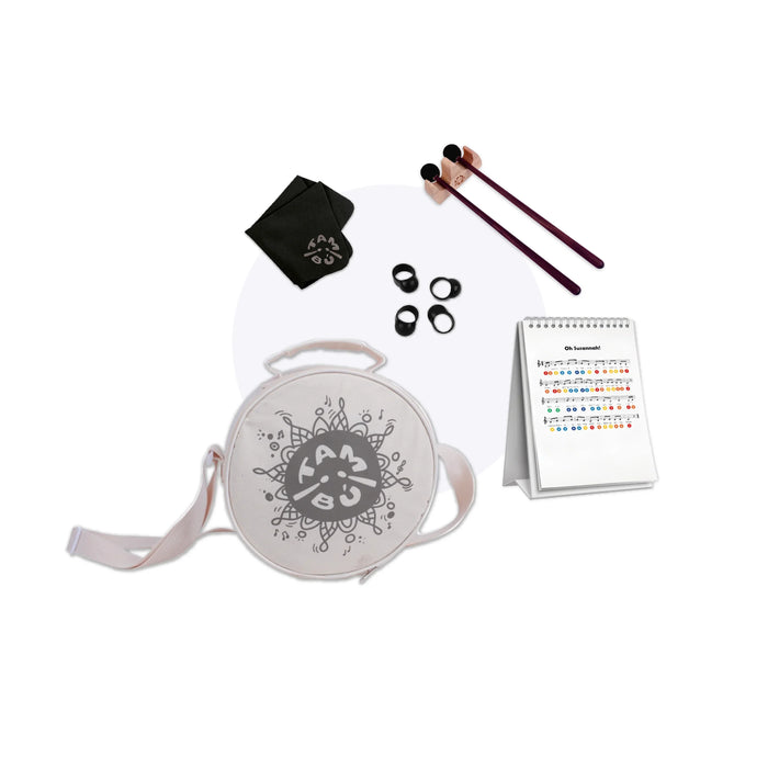 Set of drumming accessories including a drum, mallets, and a notepad on a white background