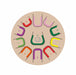 Circular wooden puzzle with colorful letters and numbers on a beige background