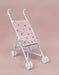 White baby doll stroller with pink canopy featuring strawberry pattern on a pink background