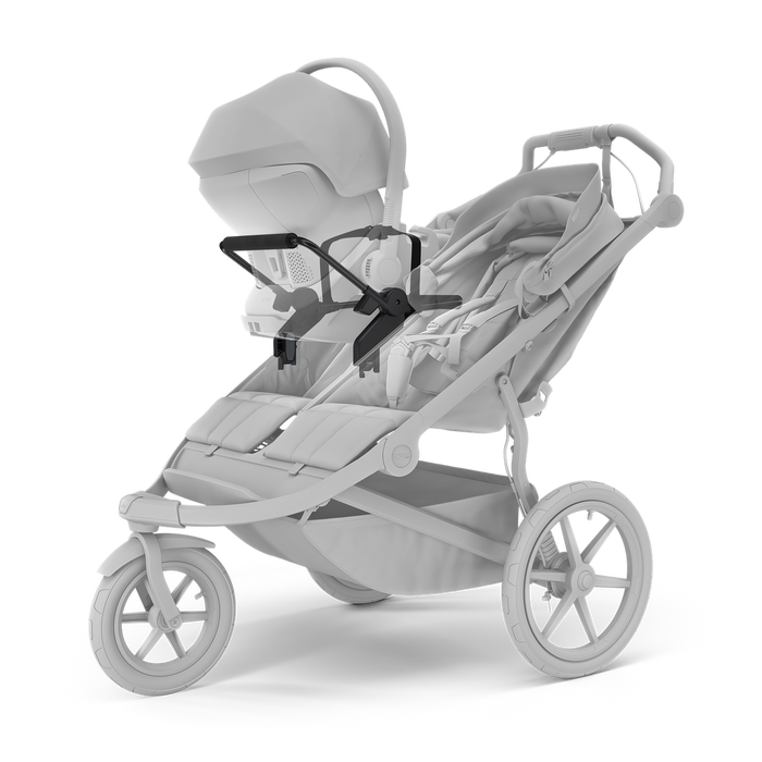 Gray stroller with a baby seat attachment on a white background