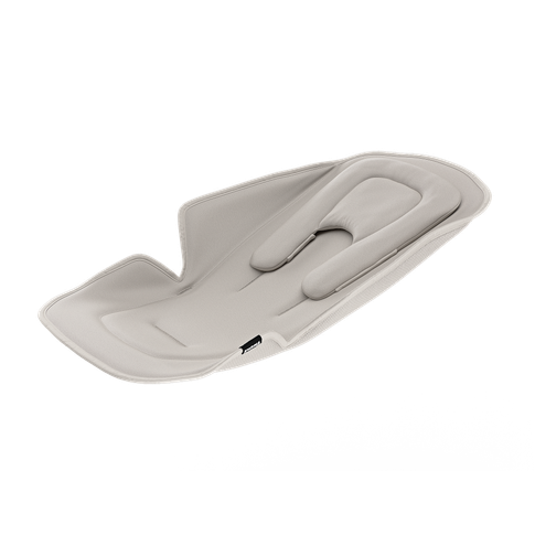 Beige newborn baby seat insert for Thule Strollers on a white background