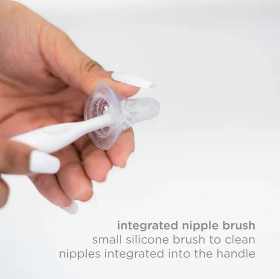 Hand holding a small silicone brush with text describing its use.