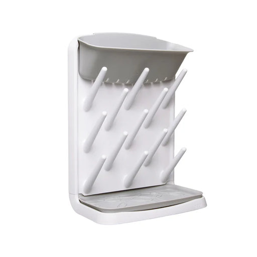 White bottle holder with multiple slots on a white background
