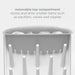 White bottle drying rack with hooks for storing smaller items on a light gray background