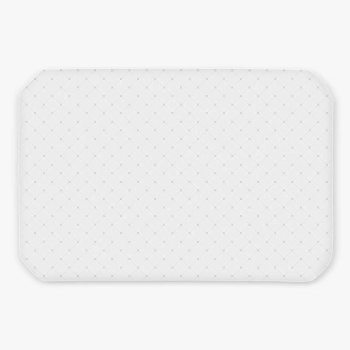 White waterproof sheet with a subtle pattern on a light gray background for use with uppababy remi playard
