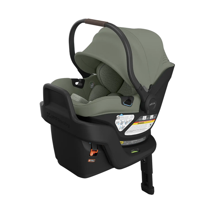Green UPPAbaby infant car seat with black base on a white background