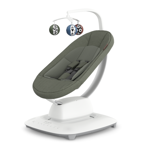 Baby swing with green cushion and hanging toys on a white background