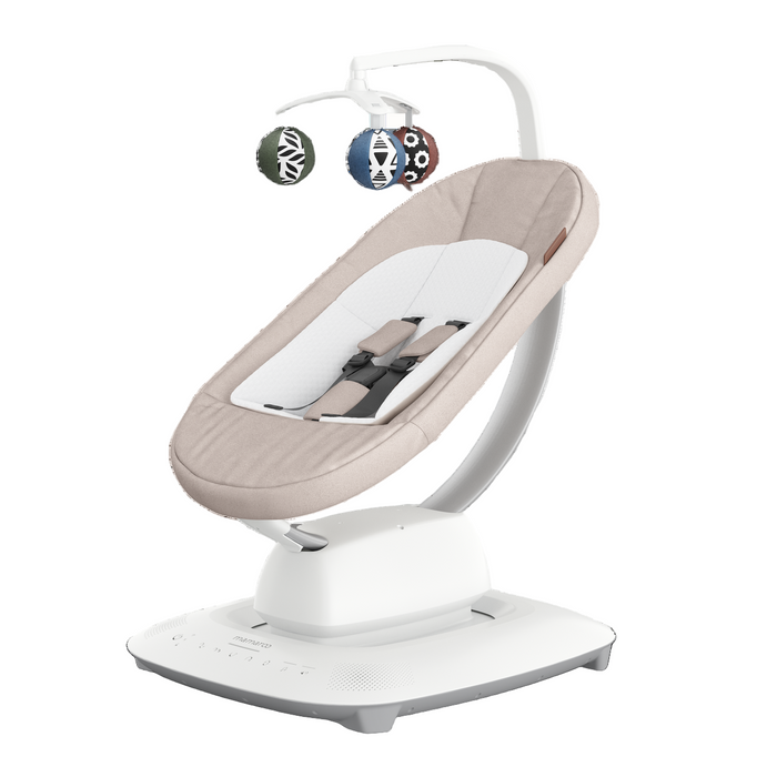 Baby swing with beige seat and white base on a white background