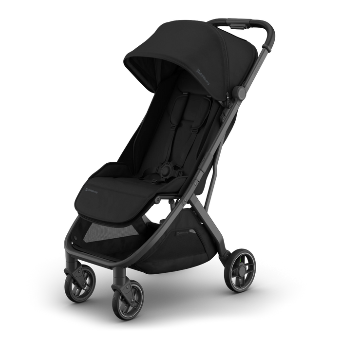 A black UPPAbaby stroller with a dark gray frame, shown at a three-quarter angle on a clean white background. The stroller features a large canopy, padded seat, footrest, and storage basket.