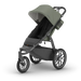 Green and black stroller on a white background