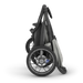Black and gray stroller on a white background