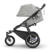 Gray and black stroller on a white background