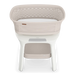 Baby bassinet with white mattress and beige cover on a white background