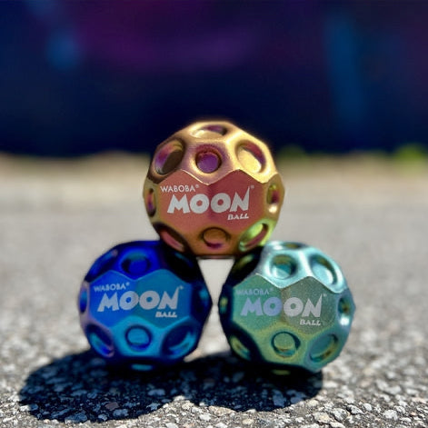 Bouncy balls stacked in an outdoor setting