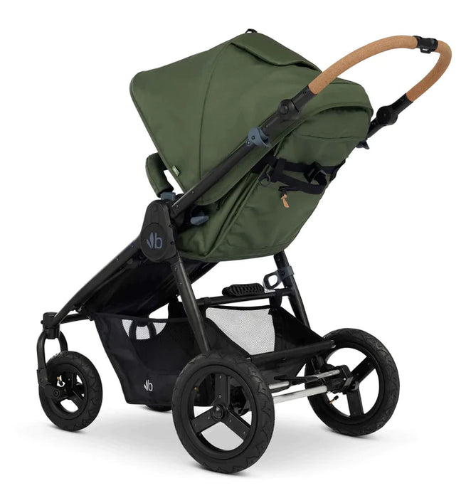 The back of the Bumbleride Era Stroller shows the four air filled tires and roomy basket, seat recline mechanism, cork handlebar and generous canopy. 
