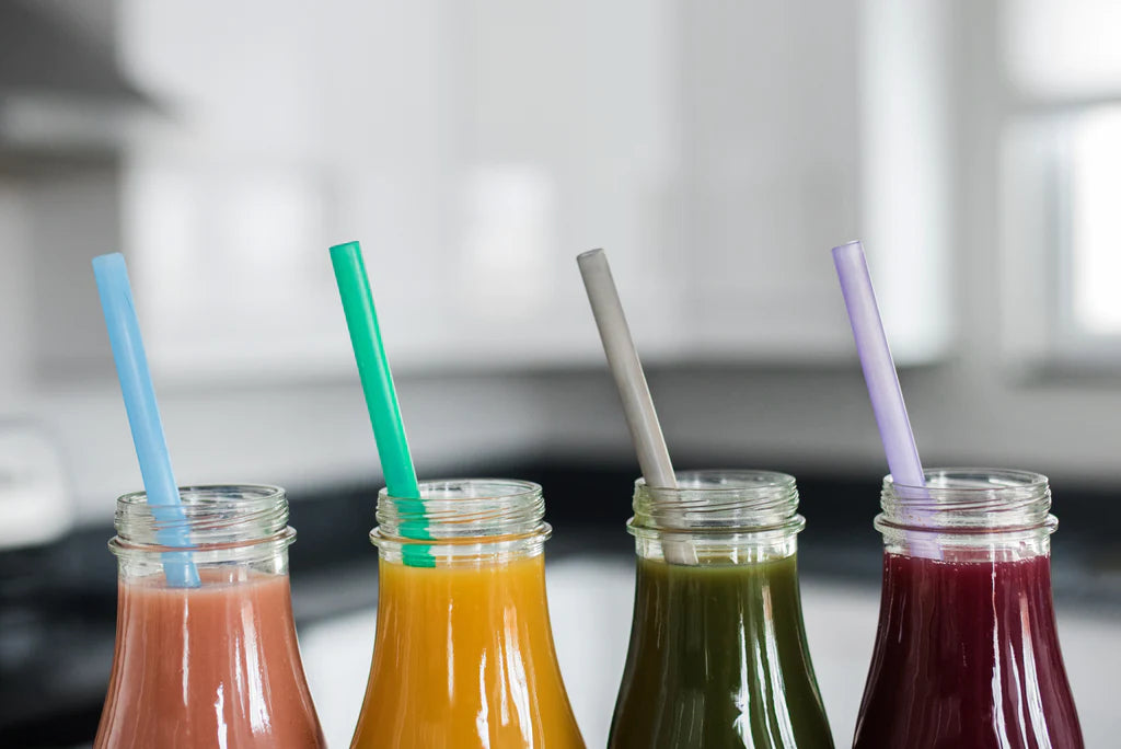 Image of 4 silicone straws in 4 individual bottles