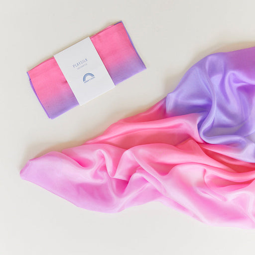 Colourful silk cloth in blossom against a white background