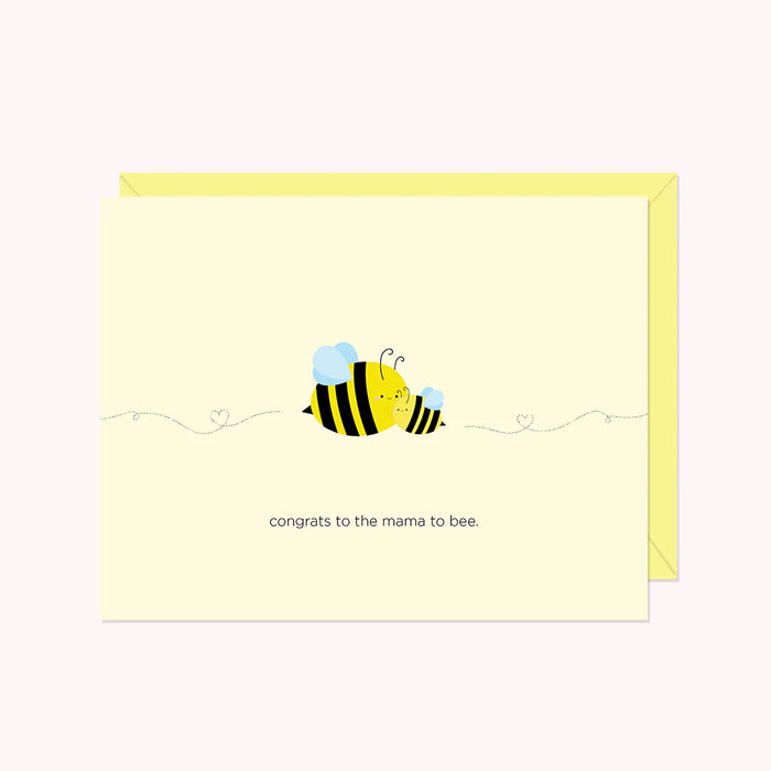 Two bees featured in yellow and black design flutter with buzz trail looping a heart shape. Card reads "Congrats to the mama to bee"