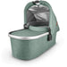 caption-Emmett Uppababy bassinet for stroller use in Emmett green melange fabric on canopy and body of bassinet plus zippered overlay. Silver metal framing to coordinate with stroller frame is exposed at upper part of bassinet